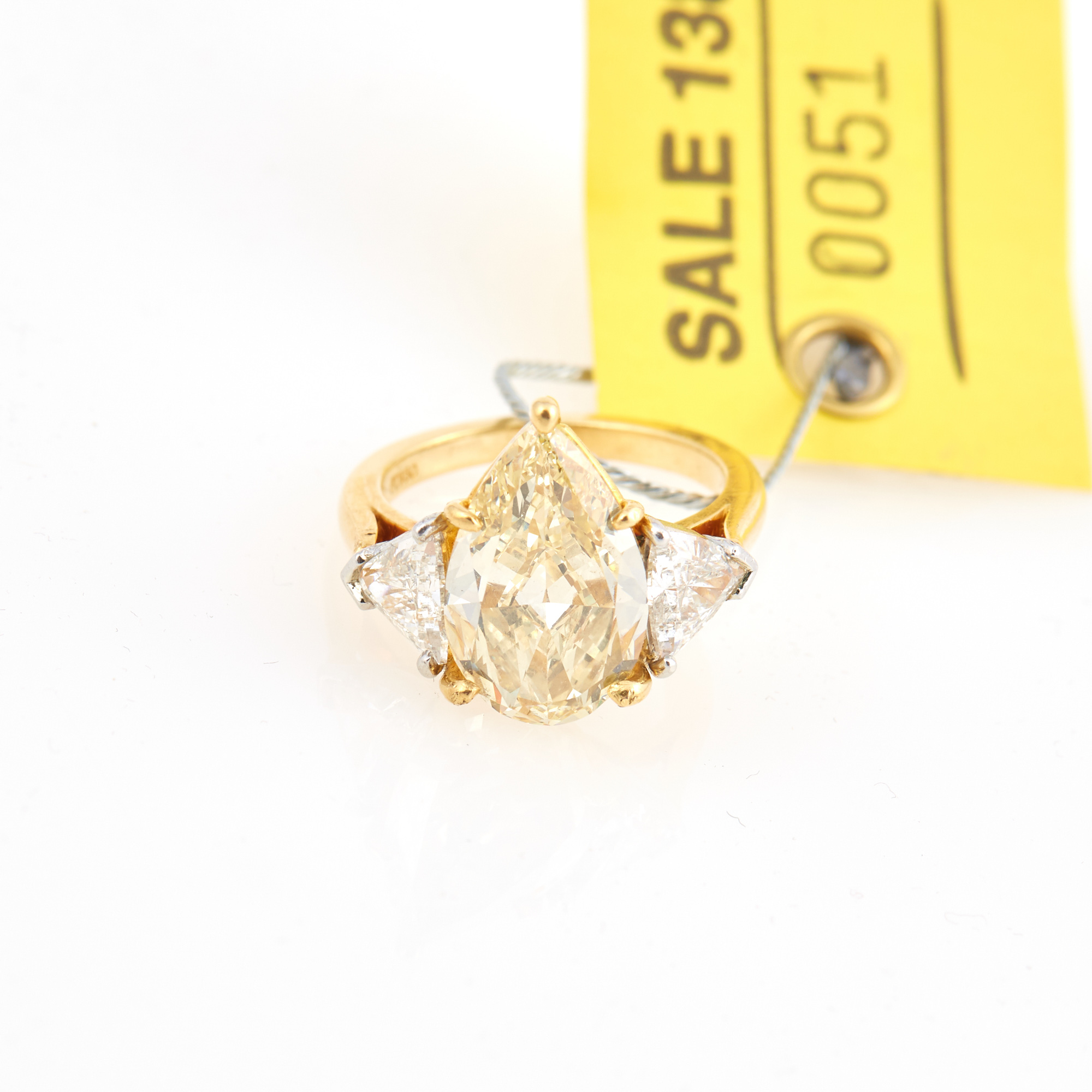 Lot image - Diamond Ring, center stone about 5.12 cts. Fancy Yellow with GIA Report #1216746552, 2 stones about 1.17 cts., Platinum and 18K 4 dwt.