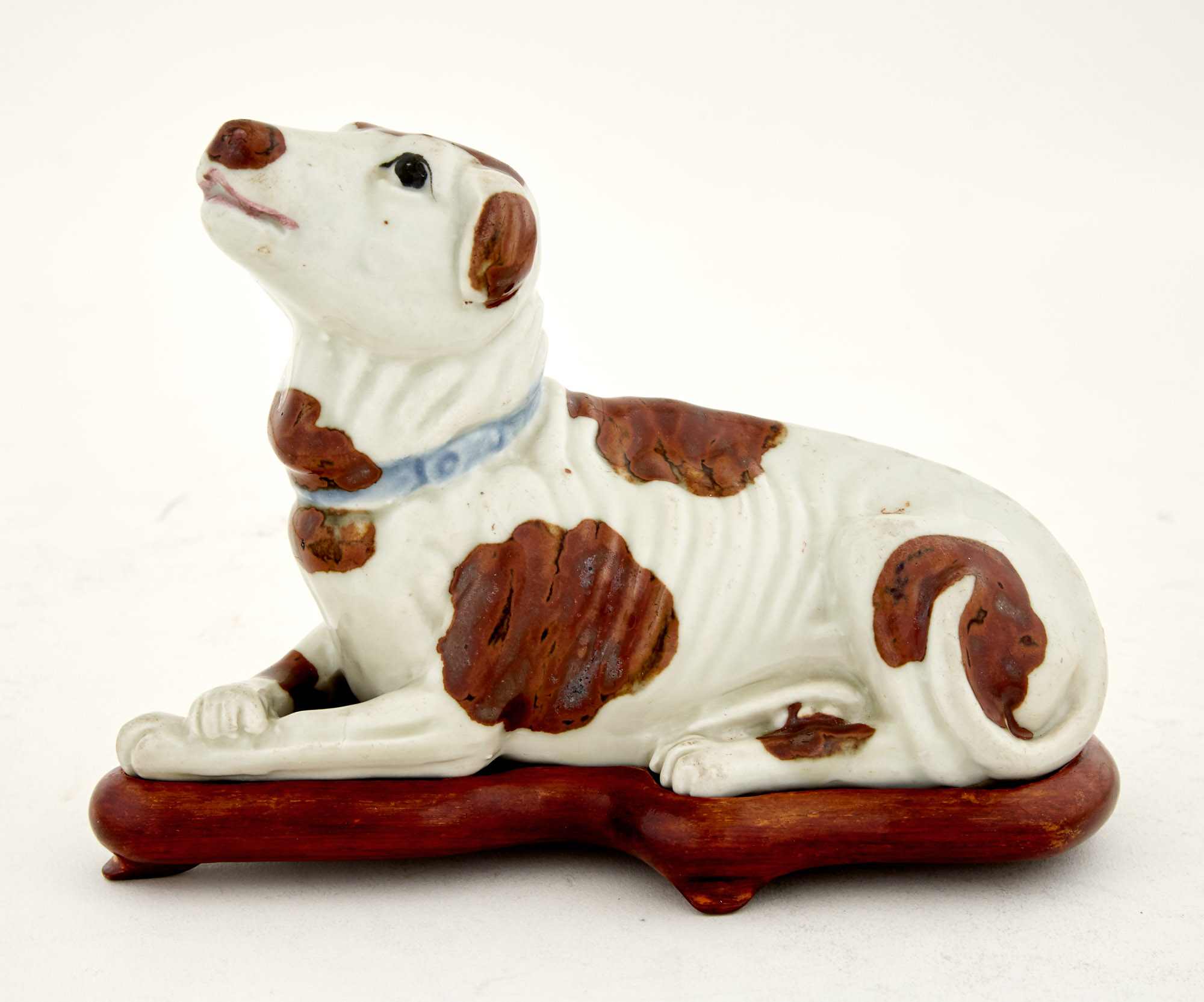 Lot image - Chinese Export Porcelain Figure of a Reclining Dog