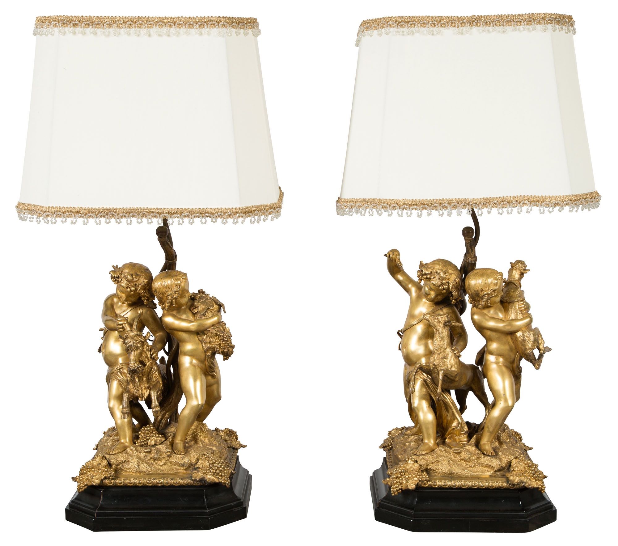 Lot image - Pair of Clodion Style Gilt-Bronze Bacchanalian Figural Lamps