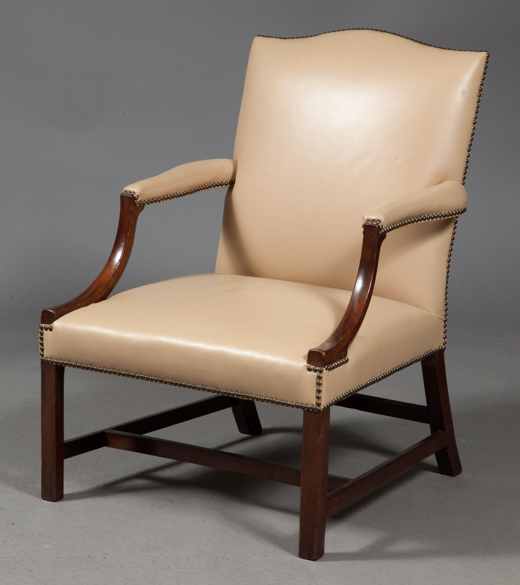 Lot image - George III Leather-Upholstered Mahogany Library Armchair