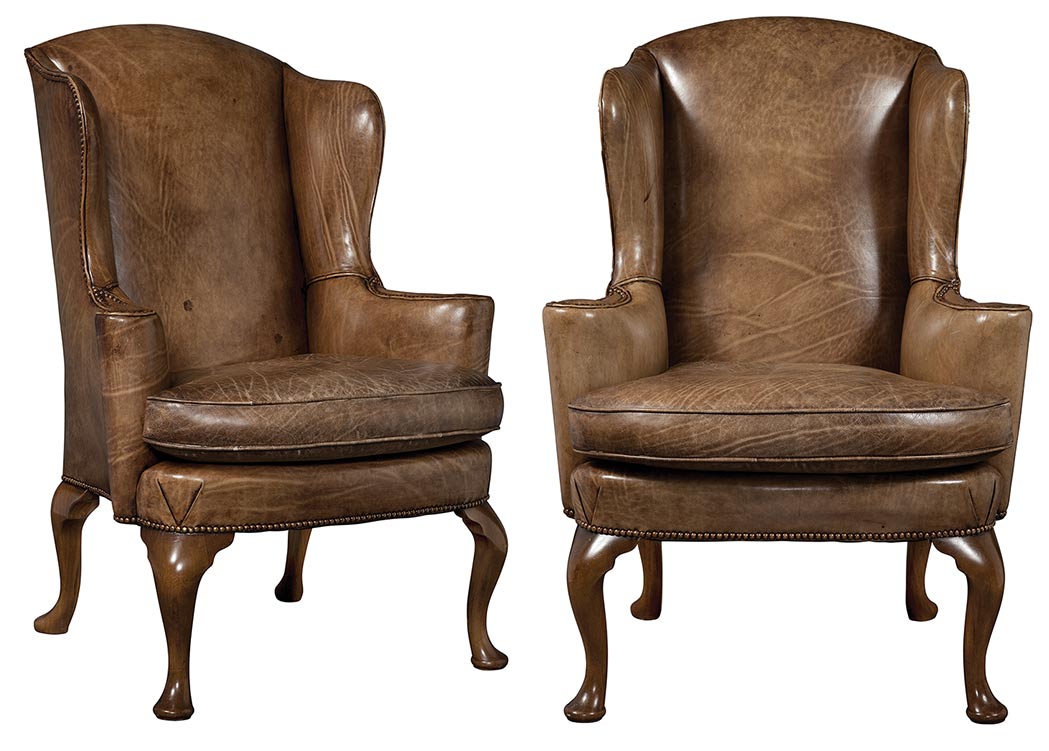 Lot image - Pair of George I Style Leather Upholstered Stained Beechwood Wing Armchairs