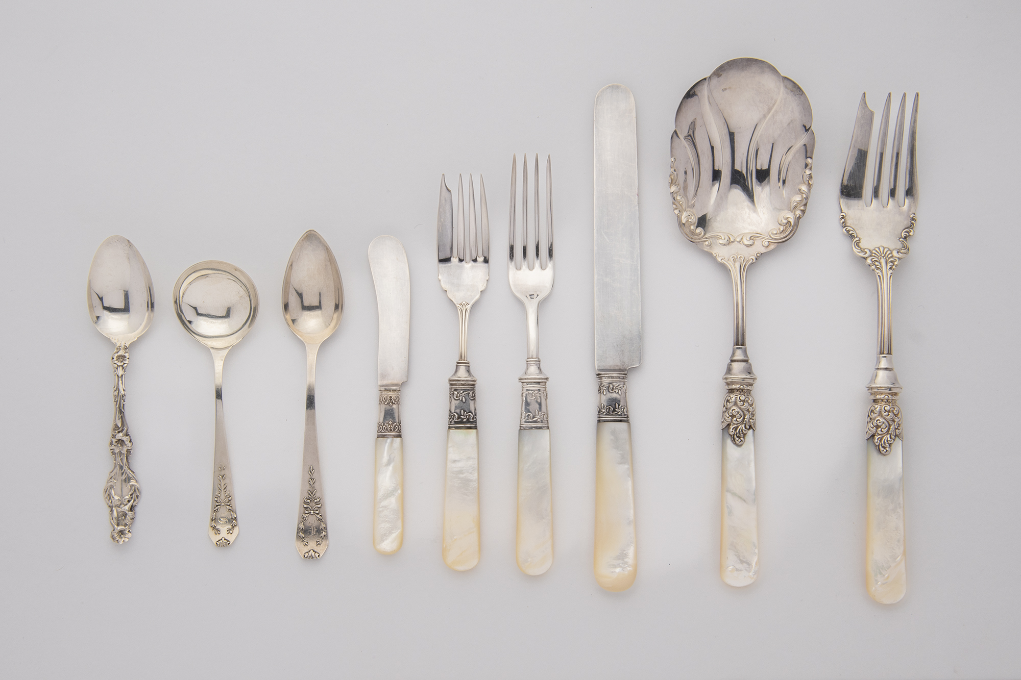 Lot image - Landers Frary and Clark Sterling Silver and Mother of Pearl Partial Flatware