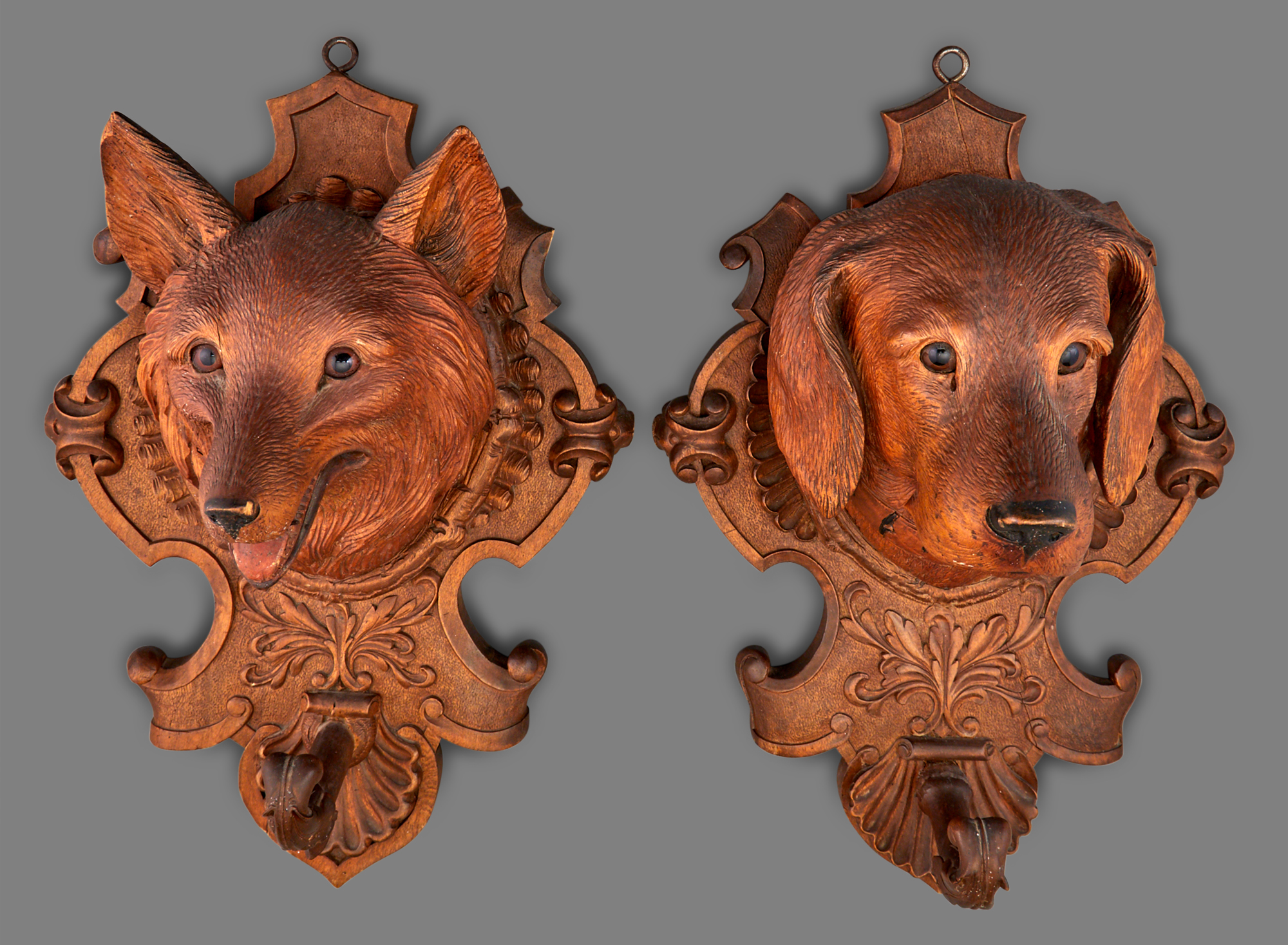 Lot image - Pair of Black Forest Carved Wood Figural Wall Ornaments