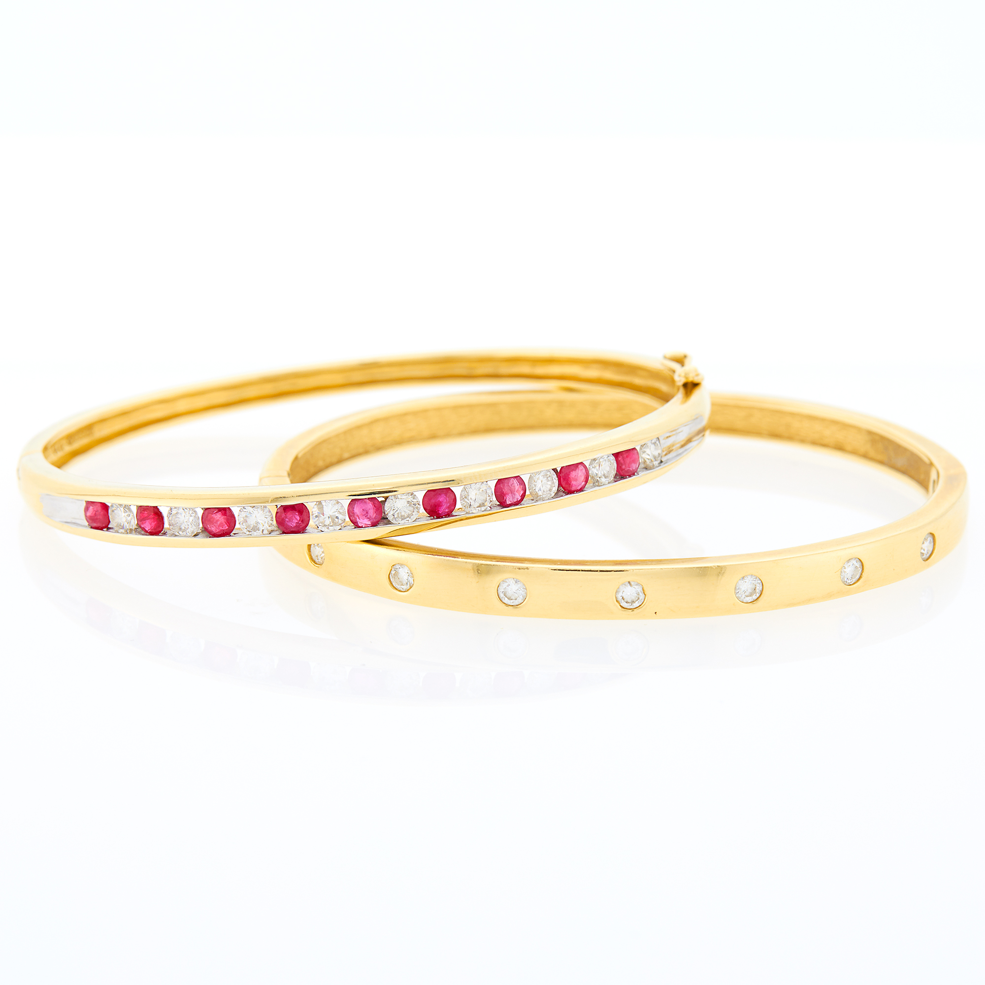 Lot image - Two Gold, Diamond and Ruby Bangle Bracelets