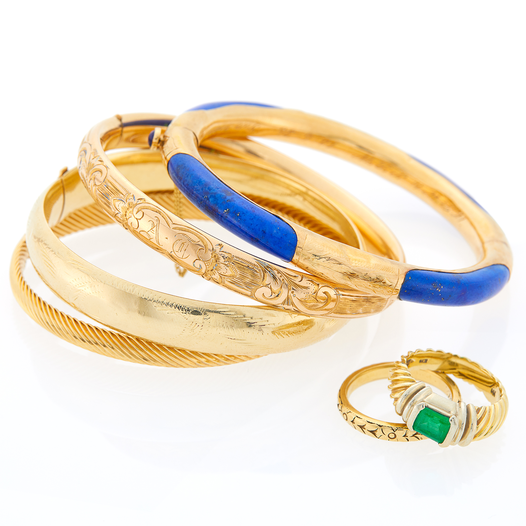 Lot image - Four Gold, Gold-Filled and Lapis Bangle Bracelets, Gold and Emerald Ring and Gold Band Ring
