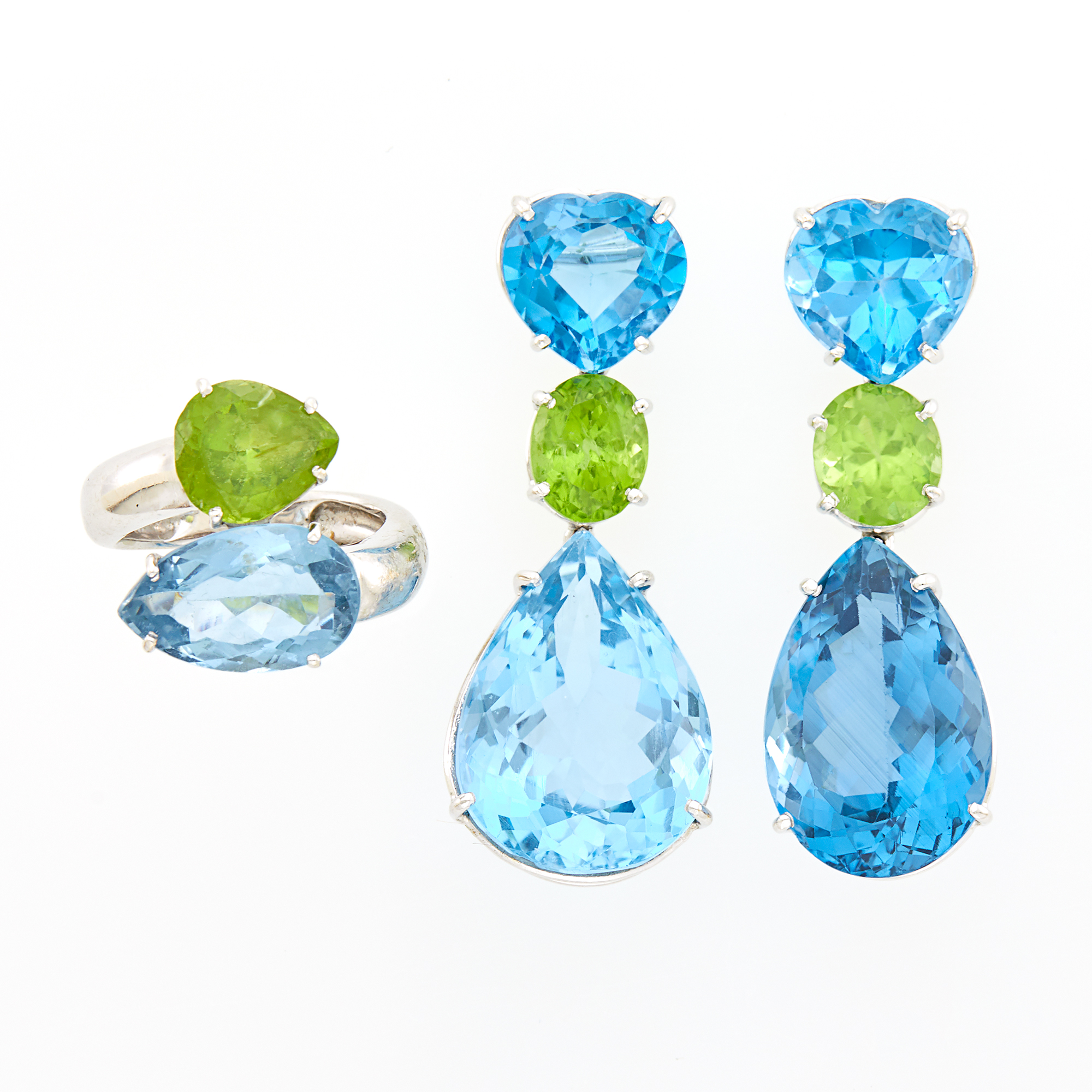 Lot image - White Gold, Blue Topaz and Peridot Bypass Ring and Pair of Pendant-Earrings