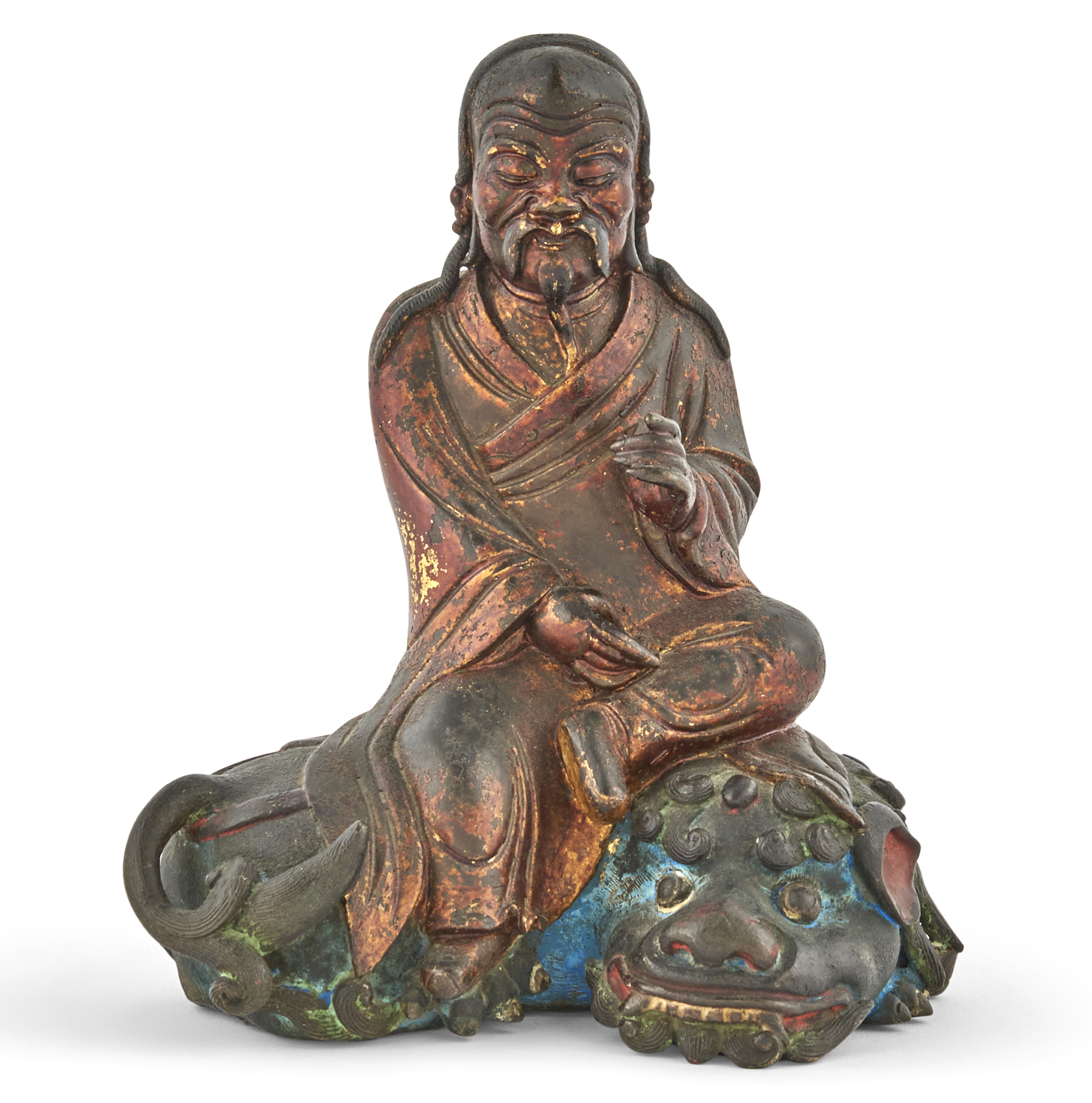 Lot image - A Chinese Polychromed and Gilt Lacquered Bronze Seated Figure in Loose Robes
