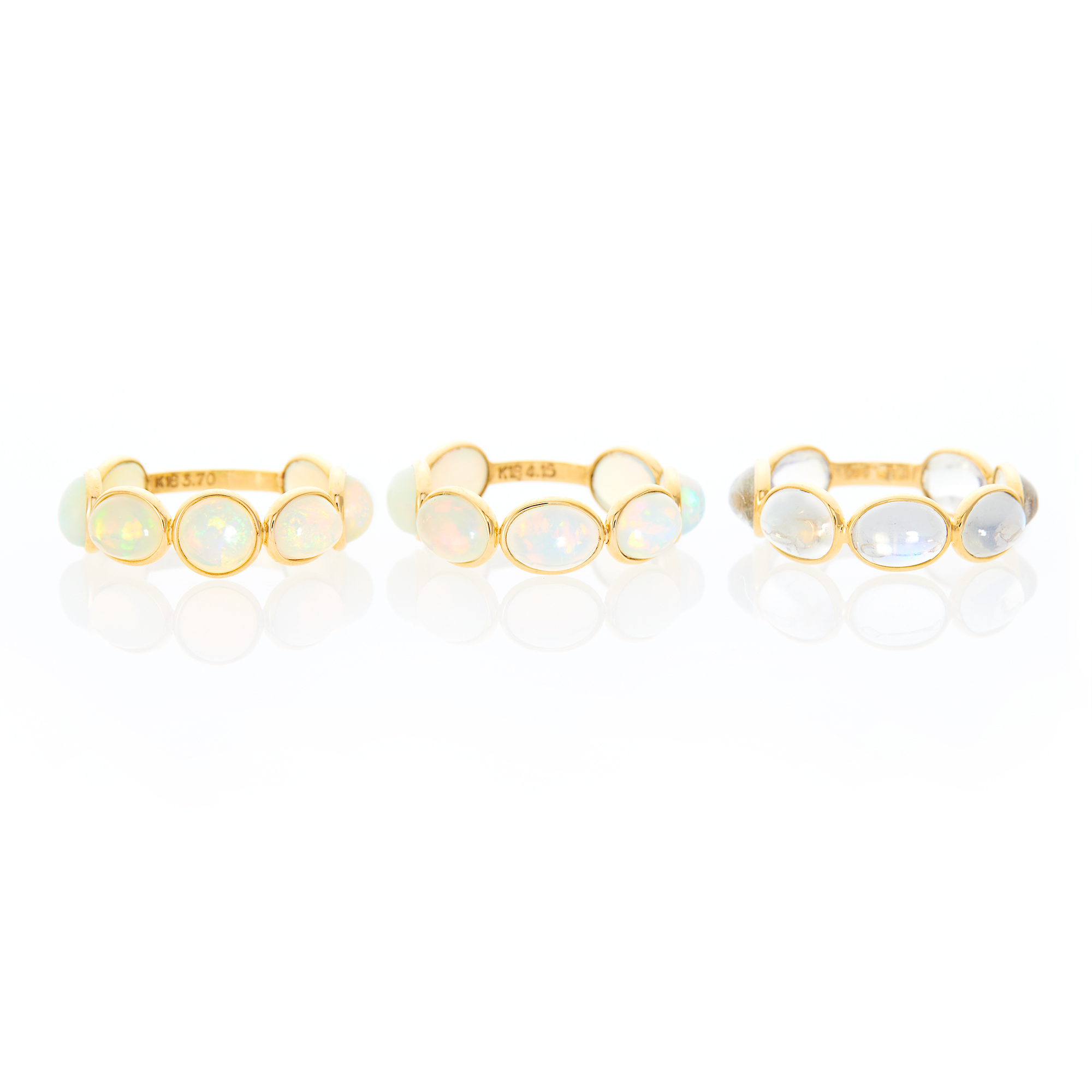 Lot image - Three Gold, Opal and Moonstone Band Rings