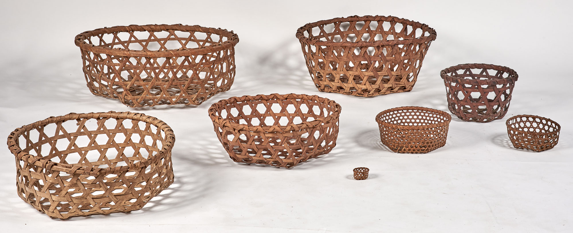 Lot image - Group of Eight Woven Splint Cheese Baskets