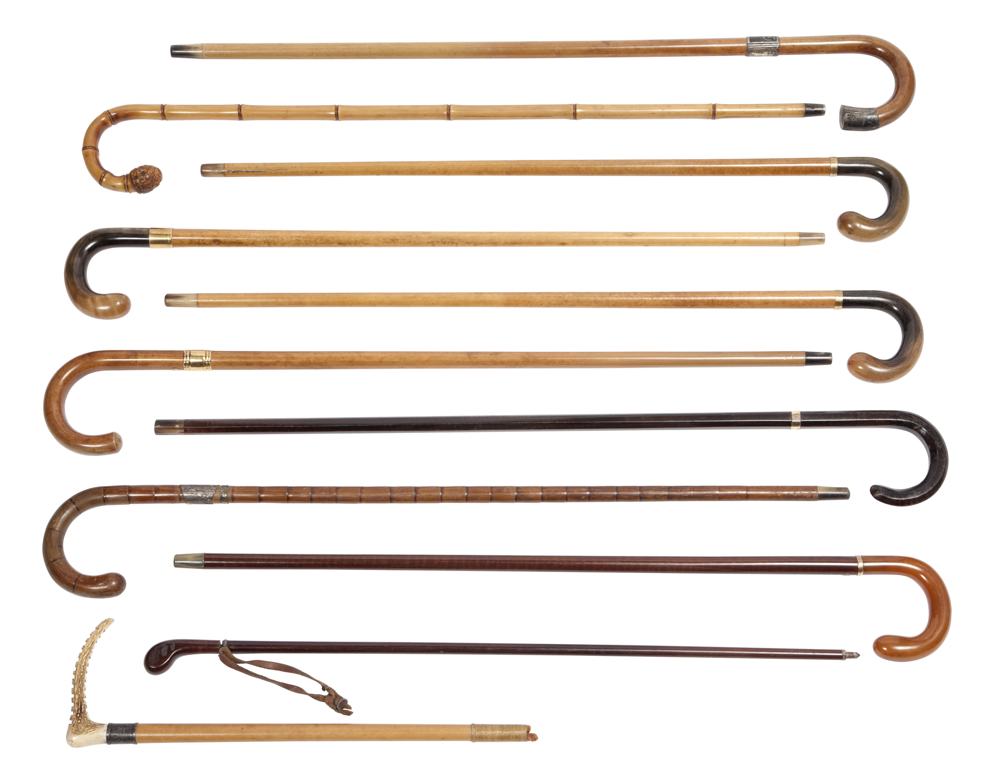 Lot image - Group of Eleven Silver or Gold-Mounted Various Woods Walking Sticks