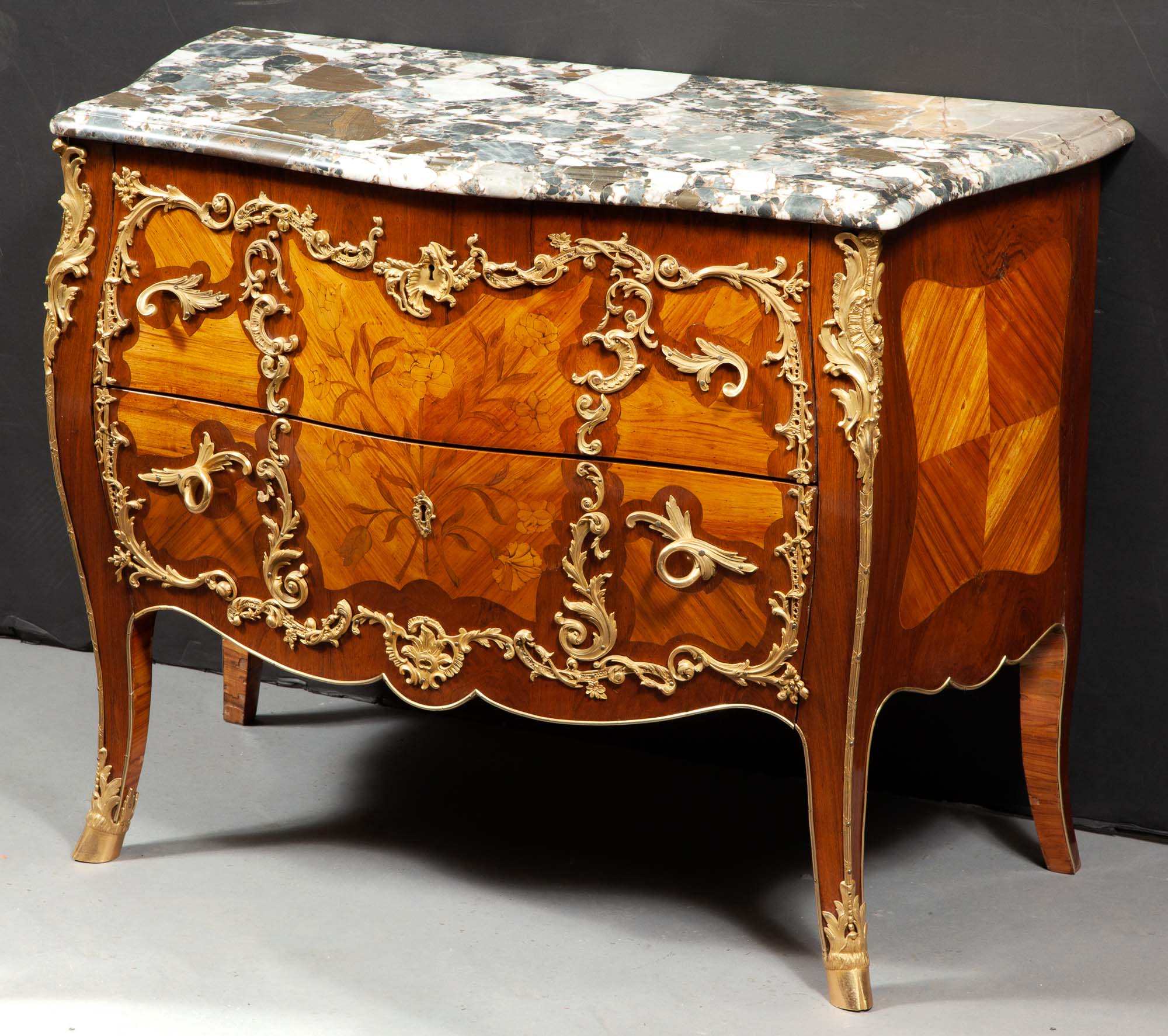 Lot image - Louis XV Style Tulipwood and Gilt-Metal-Mounted Marquetry and Parquetry Commode