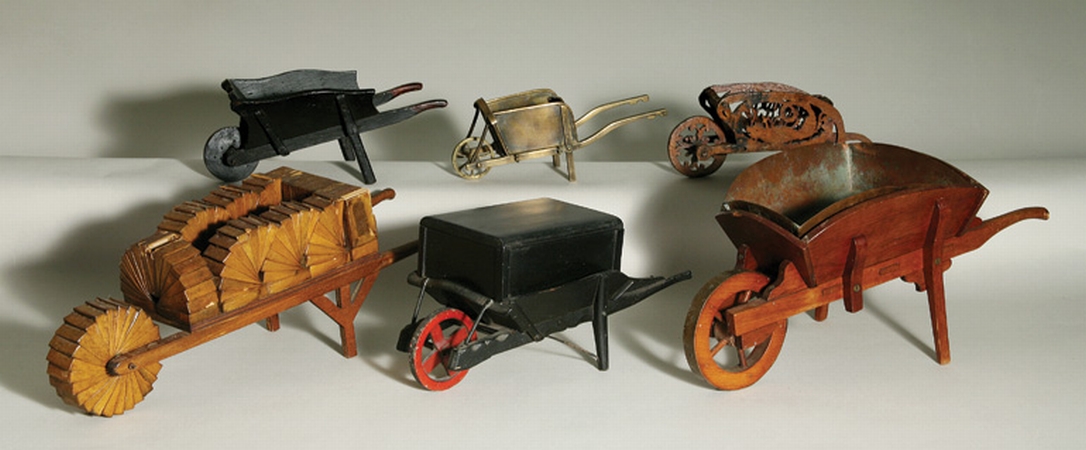 Lot image - Group of Six Wood and Brass Miniature Wheel Barrows