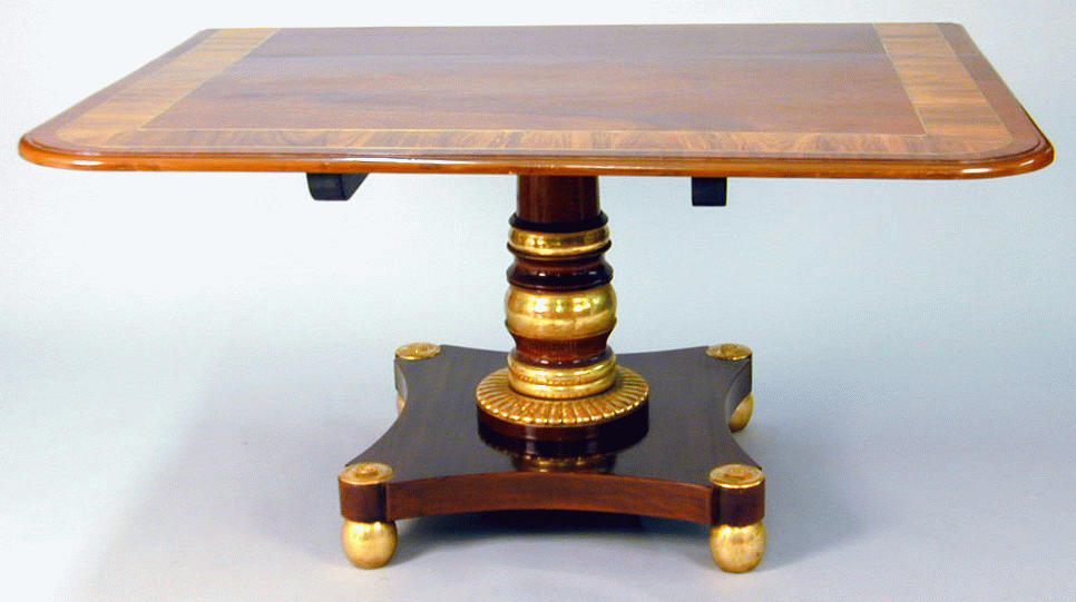 Lot image - Continental Neoclassical Style Mahogany Parcel Gilt Triple-Pedestal Dining Table