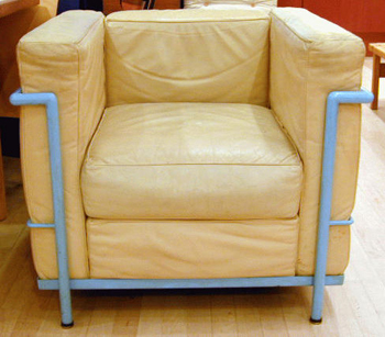 Lot image - Pair of Chrome and Leather Grand Confort Chairs   Le Corbusier, 1928   Each upholstered in cream leather, raised on a blue