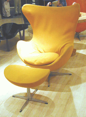 Lot image - Egg Chair and Ottoman Arne Jacobsen, 1957   Each upholstered in yellow wool, molded mark, Made in Denmark by Fritz Hanse