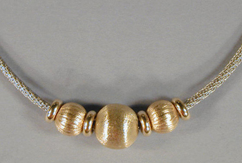 Lot image - Gold and Silver Necklace