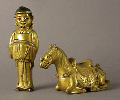 Lot image - Gilt-Bronzes of a Daoist Immortal and an Altar Accoutrement of a Recumbent Horse 17th Century