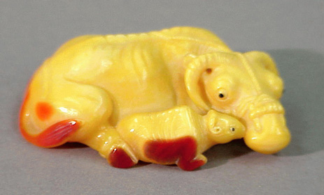 Lot image - Japanese Hornbill Casque Okimono of a Cow and Calf after Tomotada