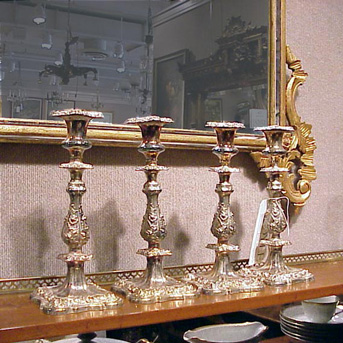 Lot image - Set of Four Georgian Style Silver Plated Candlesticks