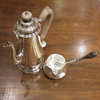 Lot image - Sterling Silver Teapot and Sauceboat Total approximately 12 ounces.