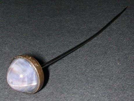 Lot image - Star Sapphire Hatpin  Silver, set with one round star sapphire.