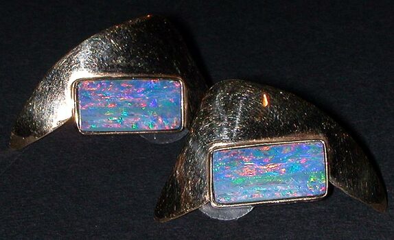 Lot image - Pair of Gold and Opal Earrings  14 kt. yellow gold, of boomerang design, each set with a rectangular-cut opal, total approx...