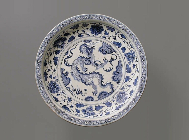 Lot image - MASSIVE BLUE AND WHITE PORCELAIN DRAGON DISH  Mid 14th century  Diameter 19 3/16 inches (48.7 cm)