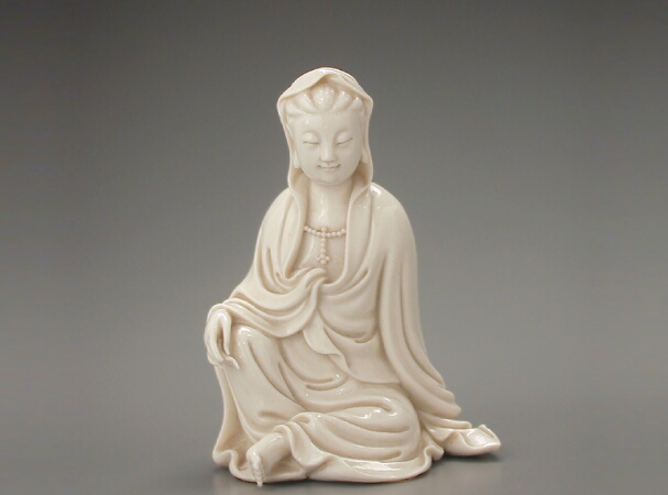 Lot image - CHINESE FUJIAN DEHUA BLANC DE CHINE WHITE PORCELAIN FIGURE OF GUANYIN  19th Century  Height 4 3/4 inches (12 cm)