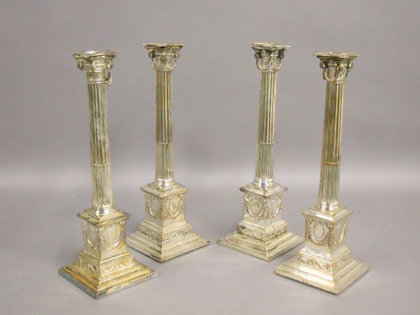 Lot image - Set of Four George III Style Silver Plated Candlesticks