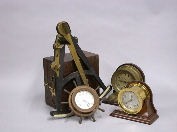 Lot image - Miscellaneous Group of Three Metal Clocks and Two Sextants