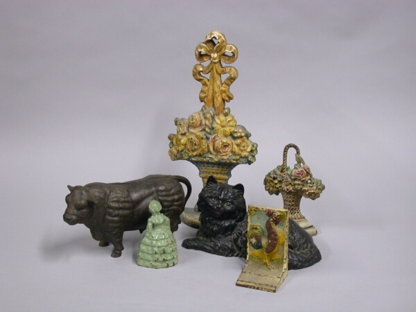 Lot image - Miscellaneous Group of Seven Cast Iron Door Stops and Banks