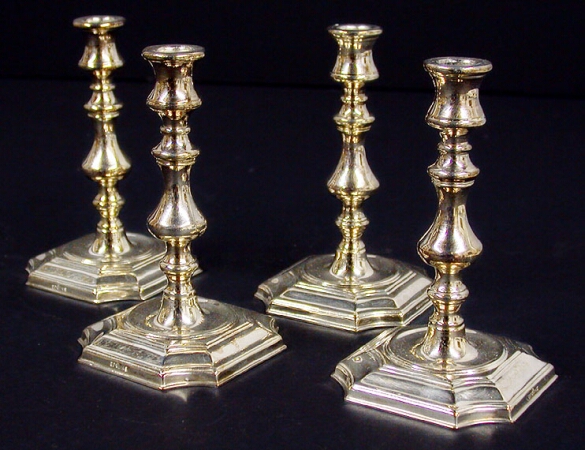 Lot image - Set of Four Georgian Style Silver Plated Candlesticks
