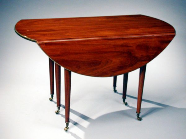 Lot image - Louis XVI Style Brass Mounted Mahogany Extension Dining Table