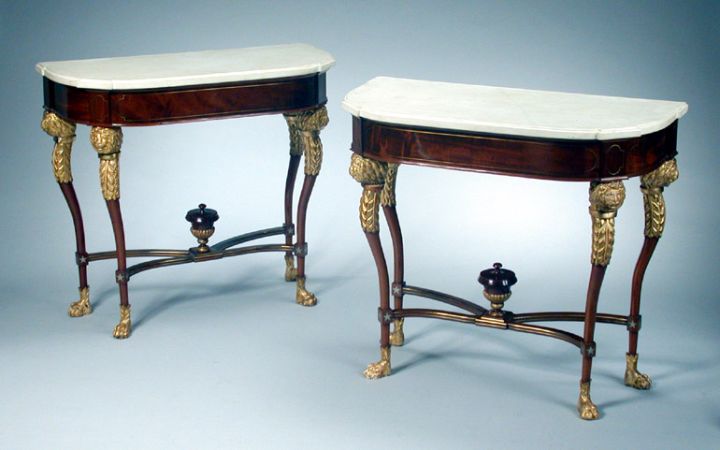 Lot image - Pair of German Neoclassical Brass Inlaid Mahogany and Parcel Gilt Consoles