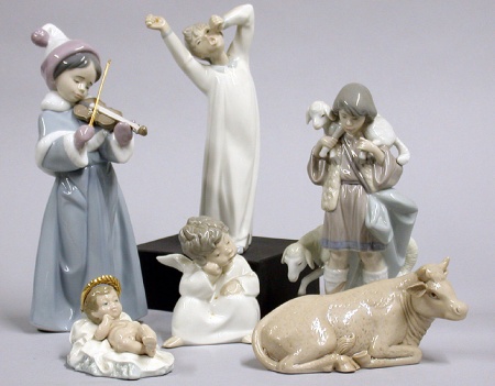Lot image - Lladro Porcelain Nativity Scene Together with a Porcelain Cow Approximately twenty-five pieces.