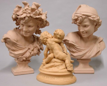 Lot image - Terra Cotta Figural Group Depicting Amorous Putti Together with Two Plaster Busts