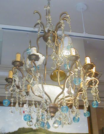 Lot image - Louis XV Style Metal and Crystal Skeletal-Form Twelve-Light Chandelier