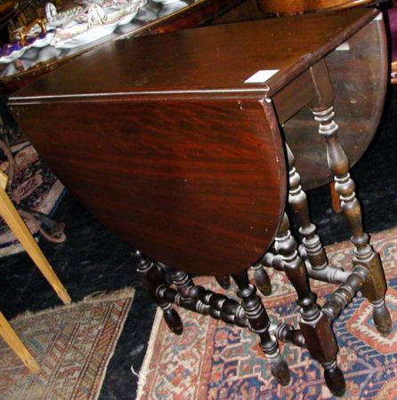 Lot image - Jacobean Style Stained Wood Gate Leg Table