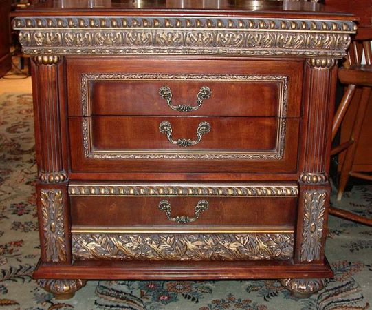 Lot image - Pair of Neoclassical Parcel Gilt and Mahogany Chests of Drawers