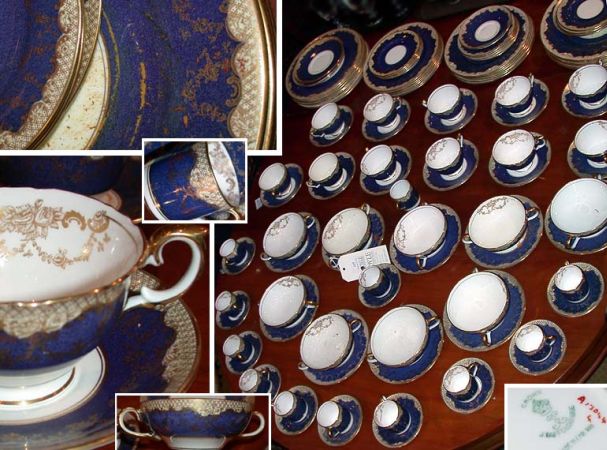 Lot image - Crown Staffordshire Gilt Decorated Blue Porcelain Dinner Service