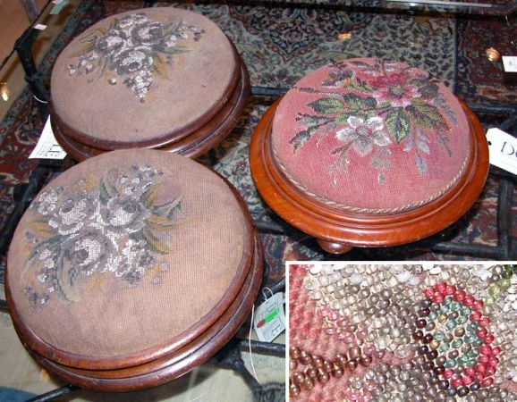 Lot image - Three Victorian Mahogany and Beaded Needlework Upholstered Circular Footstools