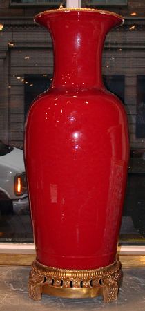 Lot image - Pair of Chinese Gilt-Bronze Mounted Sang de Boeuf Palace Urns