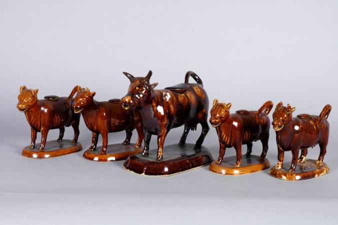 Lot image - Five Brown Glazed Pottery Cow Creamers