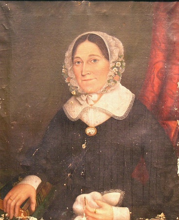 Lot image - American School 19th century PORTRAIT OF A WOMAN WITH A FLOWERED LACE BONNET