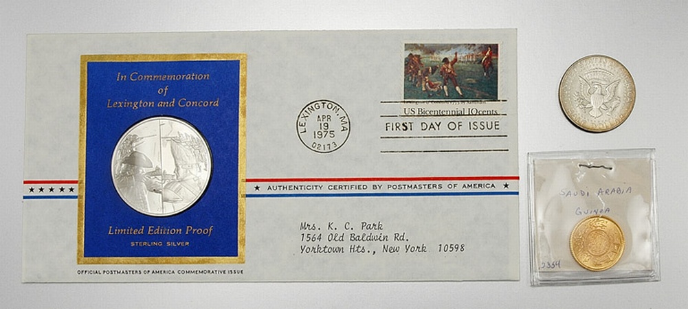 Lot image - Group of Saudi Arabian Gold Coins, U.S. Silver Half Dollars and Commemorative Postage Stamp Sets