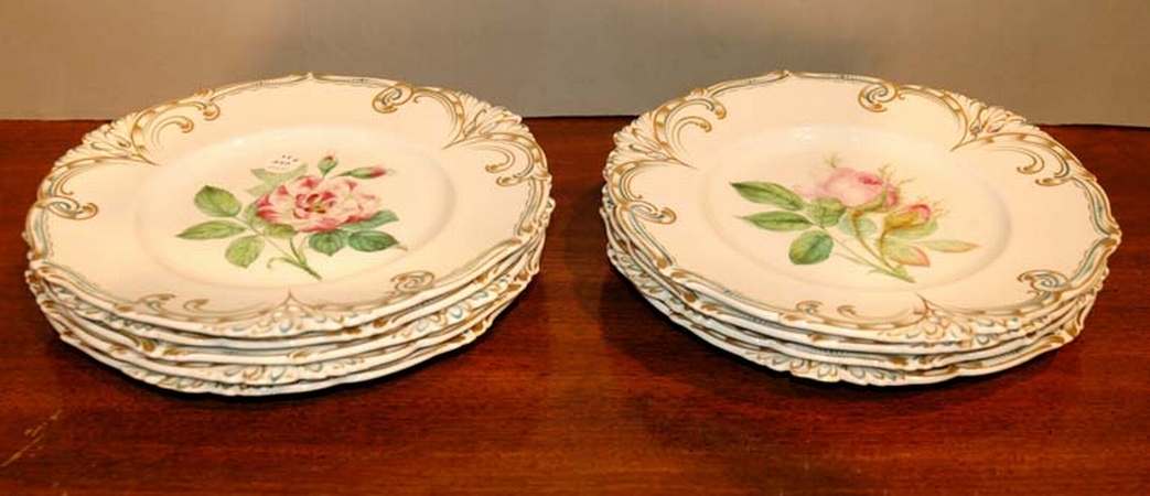 Lot image - Nine Floral Decorated Pottery Cabinet Plates