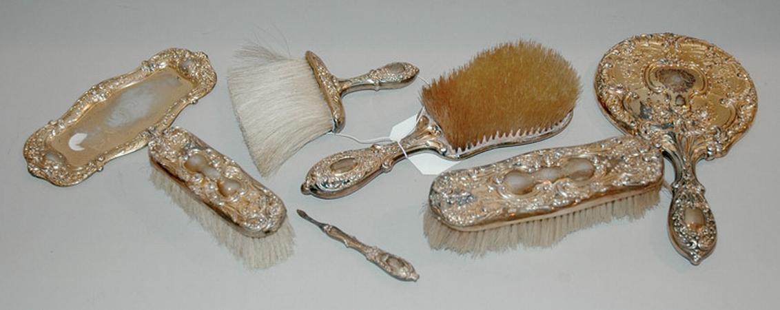 Lot image - Rococo Style Gilt-Silver Seven-Piece Dresser Set