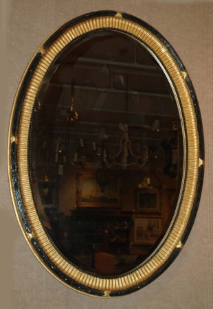 Lot image - Georgian Style Parcel Gilt and Ebonized Oval Mirror
