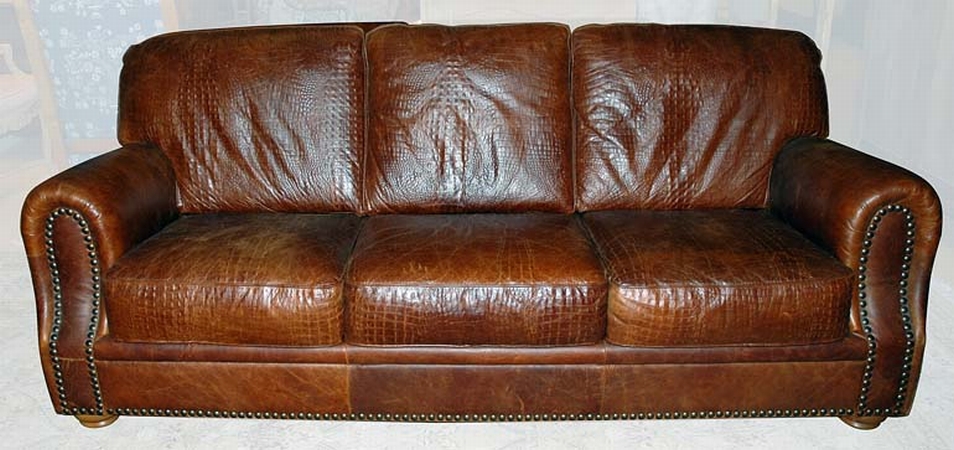 Lot image - Embossed Alligator Print Upholstered Three-Seat Sofa