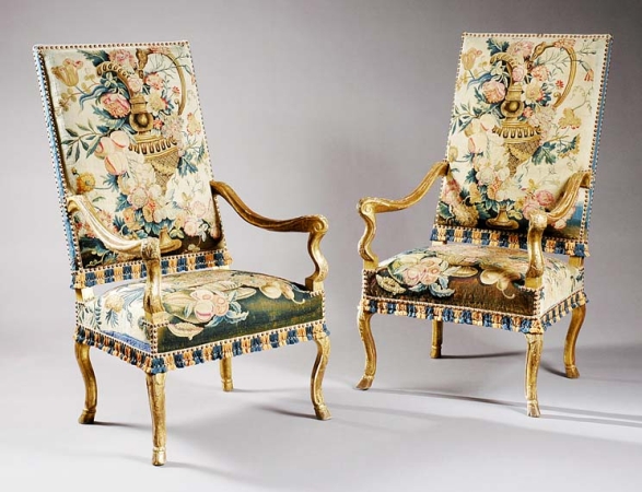 Lot image - Pair of Louis XIV Gilt-Wood Fauteuils   Circa 1700 Each rectangular high backrest with tapestry upholstery depicting...